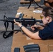 Sailors take part in a weapons qualification