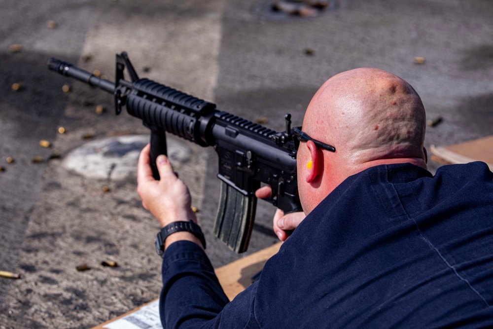 Sailors take part in a weapons qualification