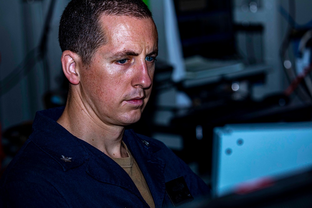 Sailors stand watch in combat