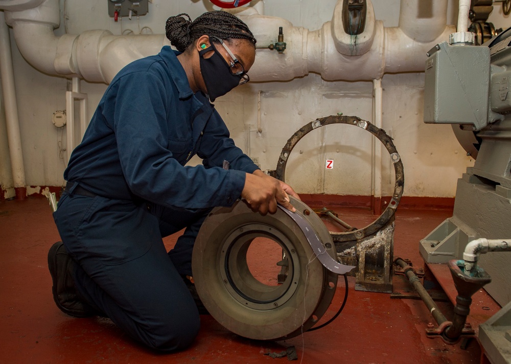 USS Carl Vinson (CVN 70) Sailor Performs Corrective Maintenance on a Water Pump