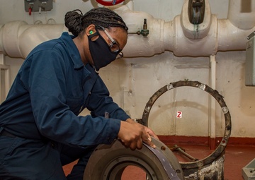 USS Carl Vinson (CVN 70) Sailor Performs Corrective Maintenance on a Water Pump