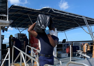 Coast Guard offloads $5.6 million in seized cocaine, transfers custody of 3 suspected smugglers in San Juan, Puerto Rico