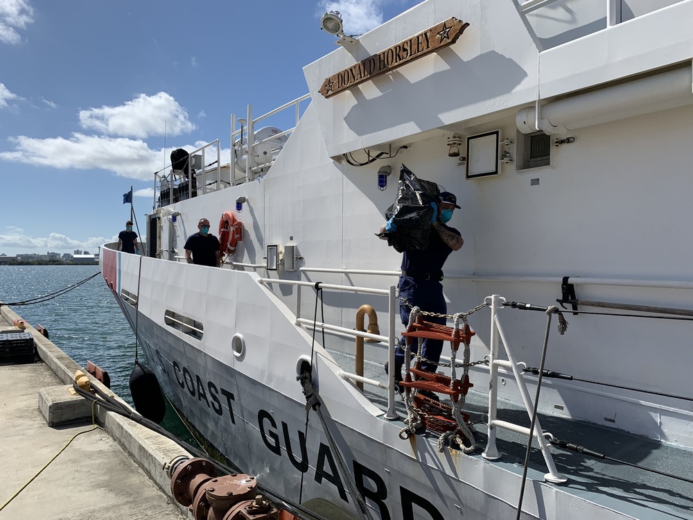 Coast Guard offloads $5.6 million in seized cocaine, transfers custody of 3 suspected smugglers in San Juan, Puerto Rico