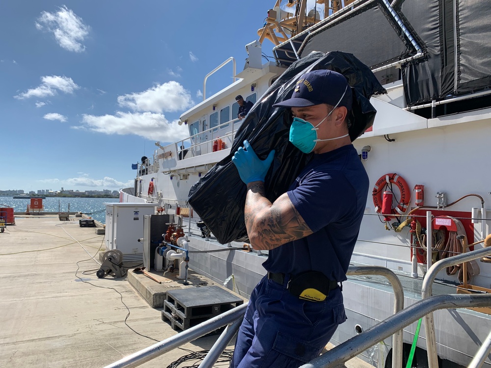 Coast Guard offloads $5.6 million in seized cocaine, transfers custody of 3 suspected smugglers in San Juan, Puerto Rico