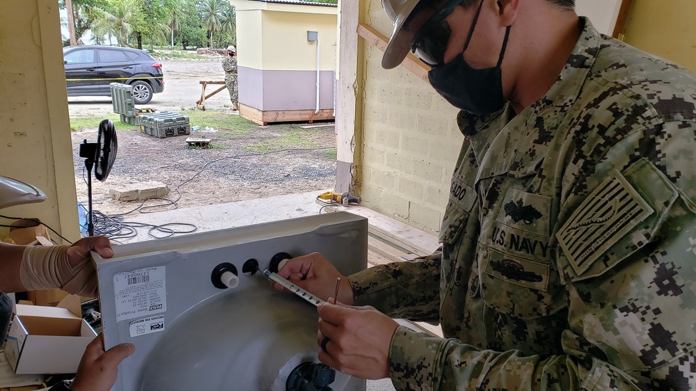 U.S. Navy Seabees with NMCB-5 build head and shower facilities for a COVID-19 response compound in Pohnpei