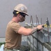 U.S. Navy Seabees with NMCB-5 build concrete masonry unit enclosures at Torii Housing onboard Marine Corps Air Station, Iwakuni