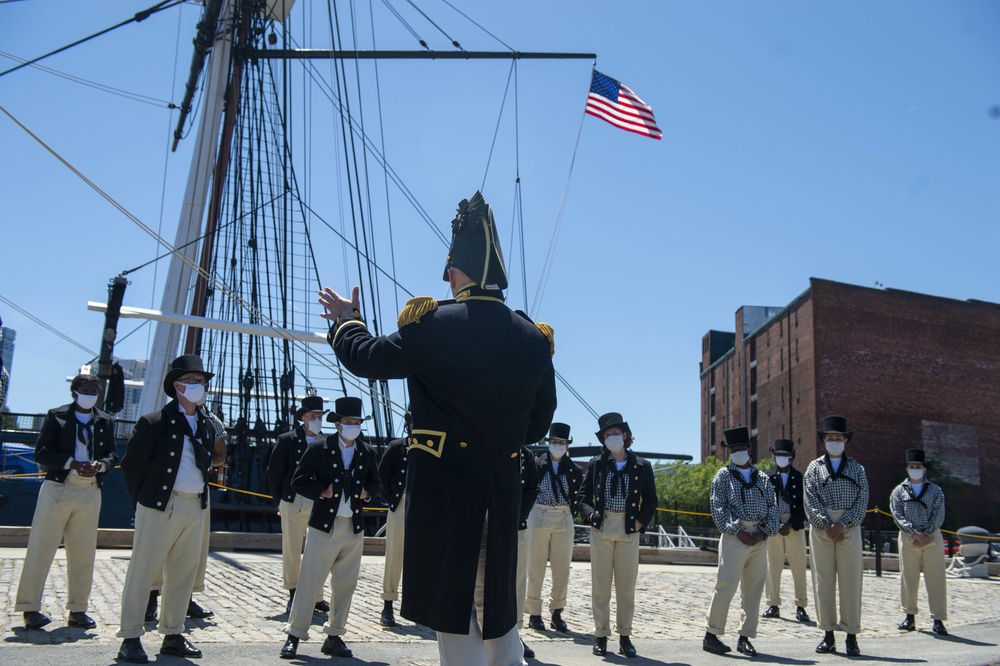 Commander John Benda, Commanding Officer of USS Constitution, talks with the crew