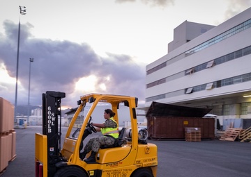 Naval Supply System Command Fleet Logistic Center Pearl Harbor prepares tri-wall postal packages for the Nimitz Carrier Strike Group