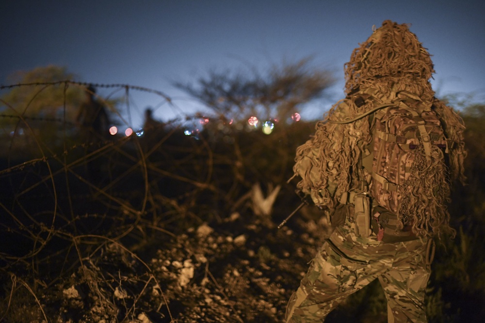 Task Force Guardian members conduct reconnaissance training at night