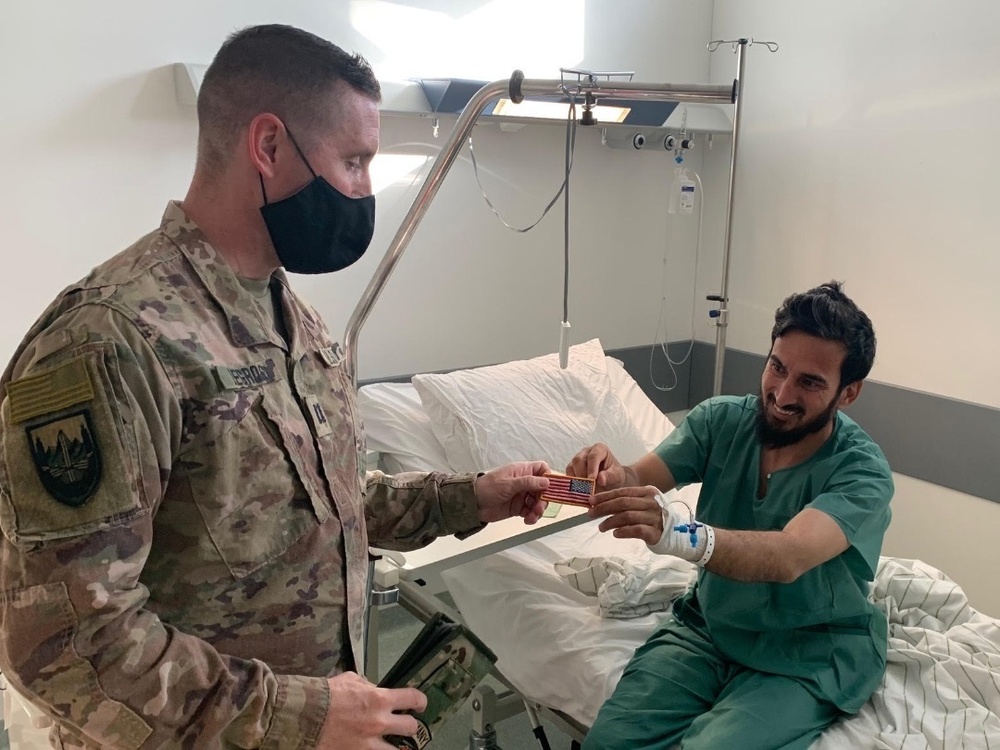 Lt. Col. Hamid Saifi Receives American Flag Patch While Recovering