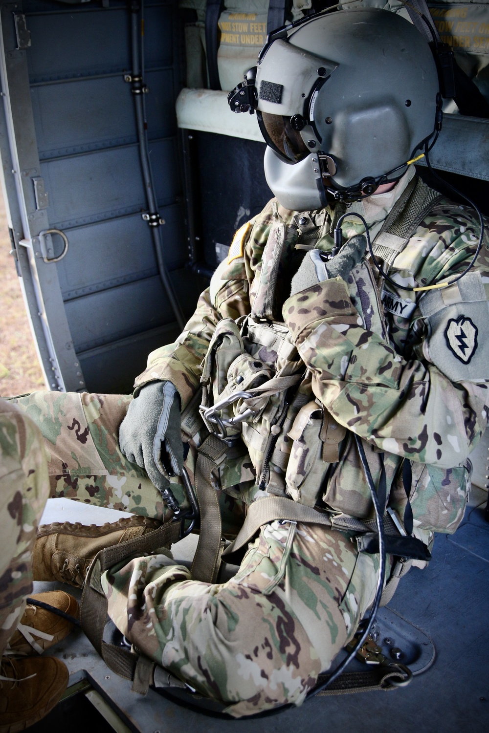 Aviation Soldier assists Artillery unit in howitzer sling load