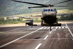 Aviation supports Artillery tables by howitzer sling load