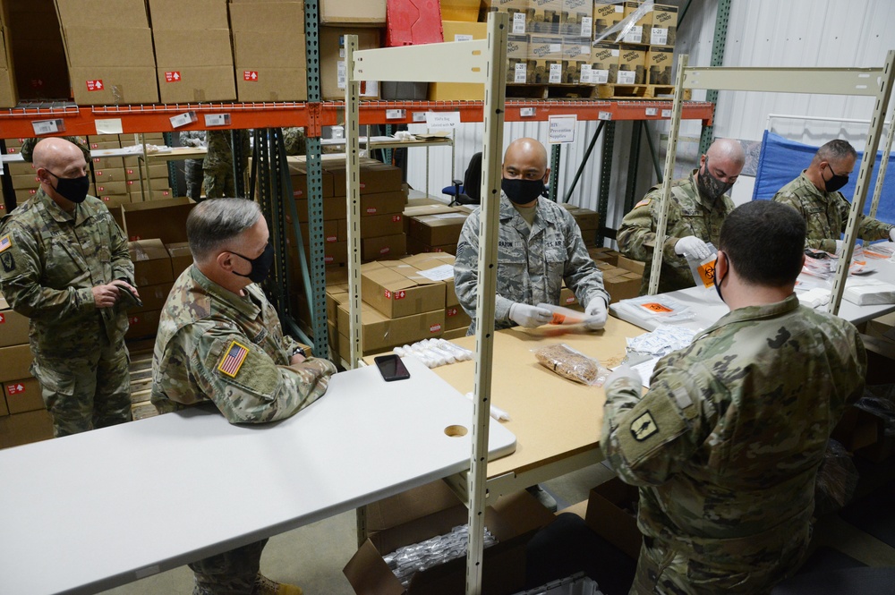 Bret D. Daugherty, Adjutant General, Washington State visits COVID-19 test kit assembly site