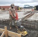 U.S. Navy Seabees with NMCB-5’s Detail Sasebo construct two pre-engineered buildings for Naval Beach Unit 7