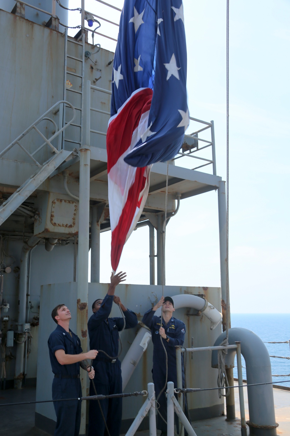 Sailors raise US flag aboard USS Oak Hill