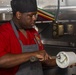 Sailors and Marines cook in the galley