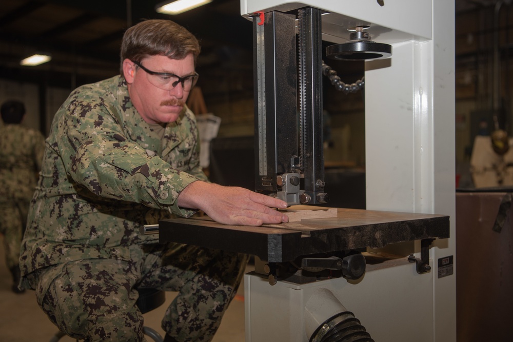 George Washington Sailor Cuts Wood