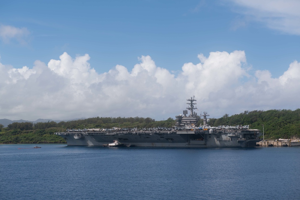 Nimitz sits pier side in Guam during a Safe Haven Liberty port visit