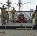 Sailors assigned to USS Constitution demonstrate how guns would have been fired during the age of sail