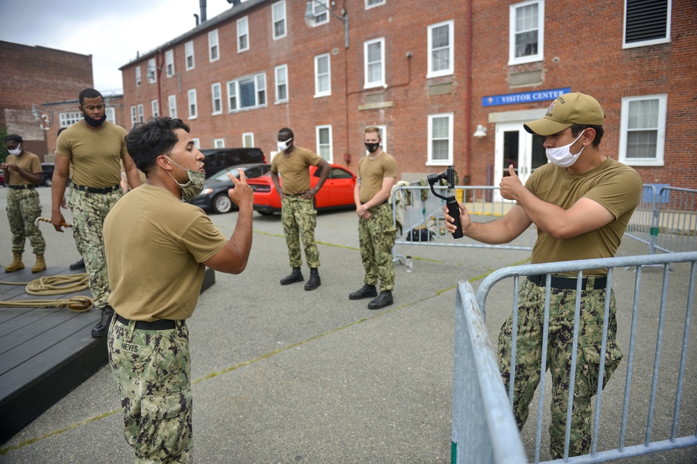 Sailors assigned to USS Constitution demonstrate how guns would have been fired during the age of sail