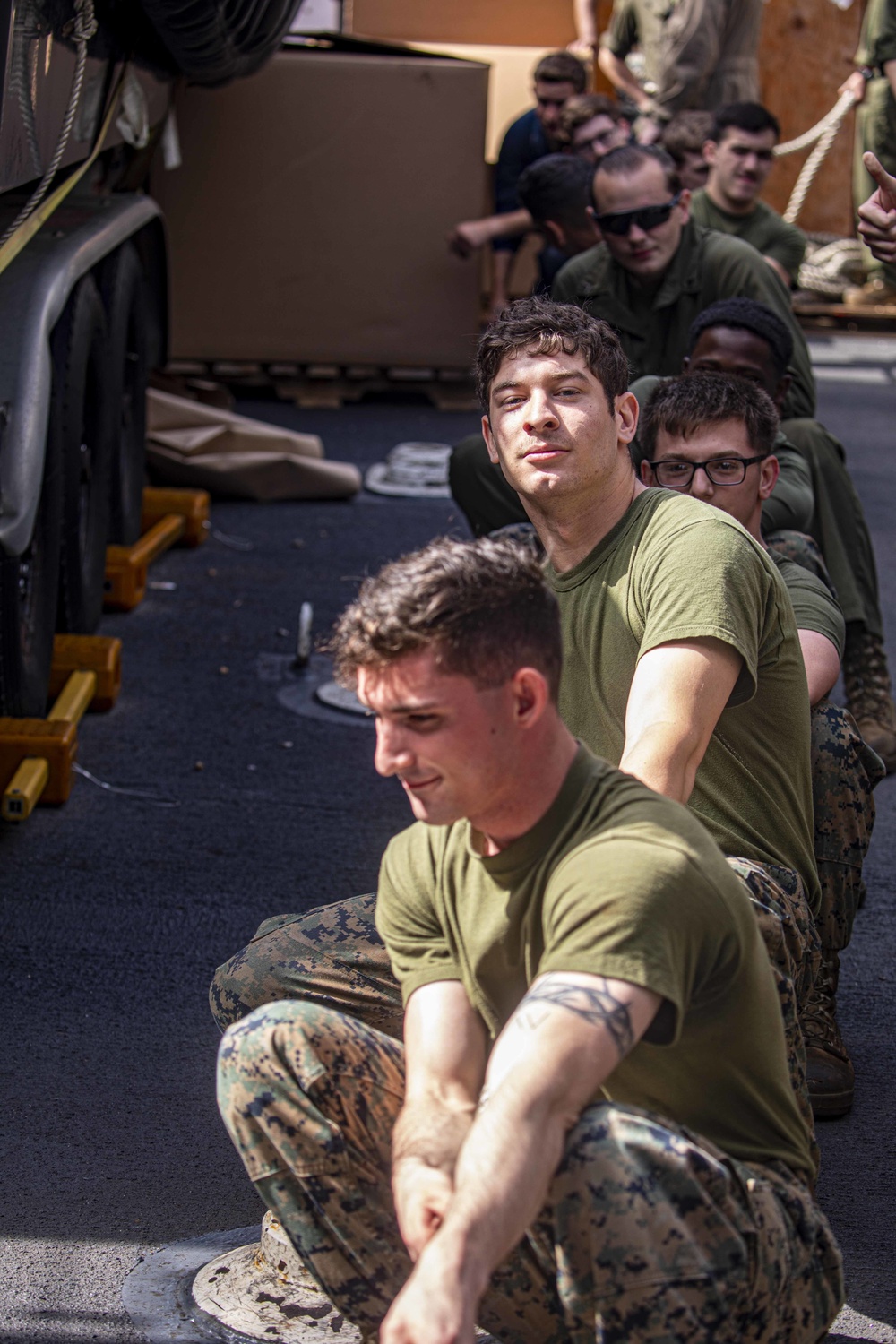 Sailors and Marines take part in a replenishment-at-sea