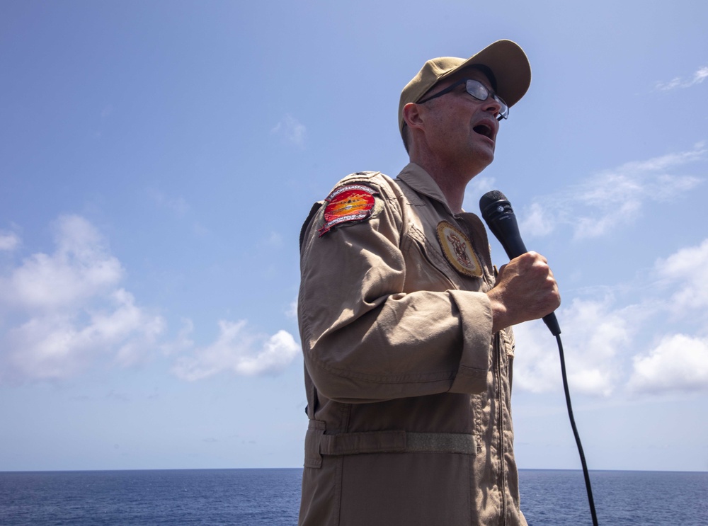 USS New York's Commanding Officer speaks during all hands call