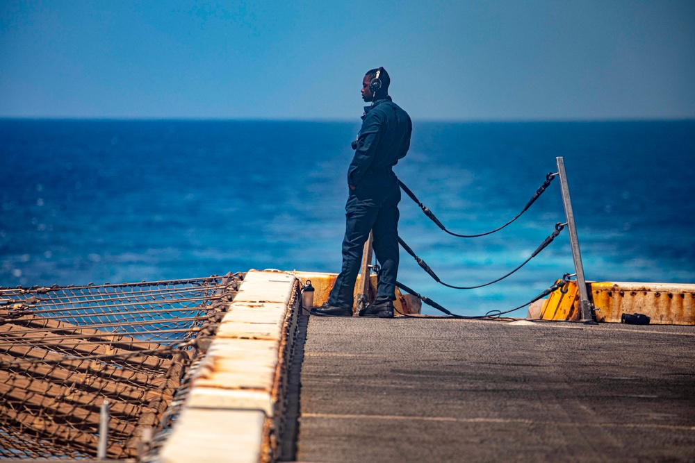 Sailor stand watch aboard New York