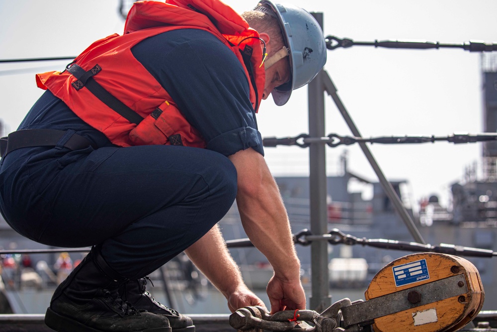 Sailors take part in a replenishment-at-sea