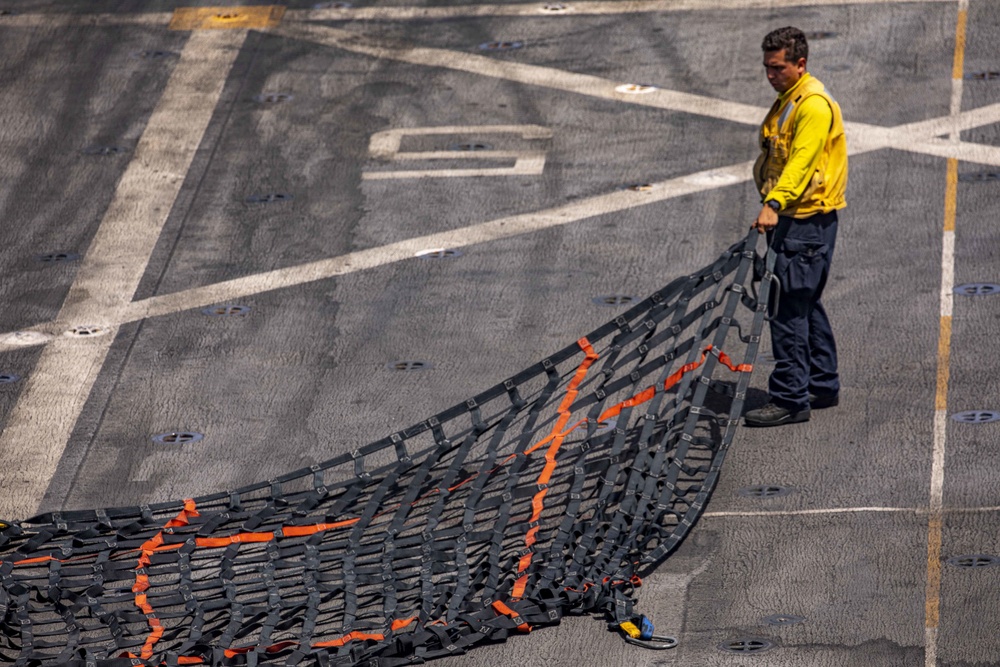 Sailors take part in a replenishment-at-sea