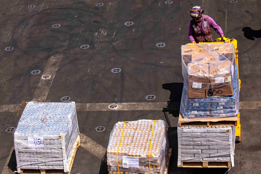 Sailors take part in a replenishment-at-sea