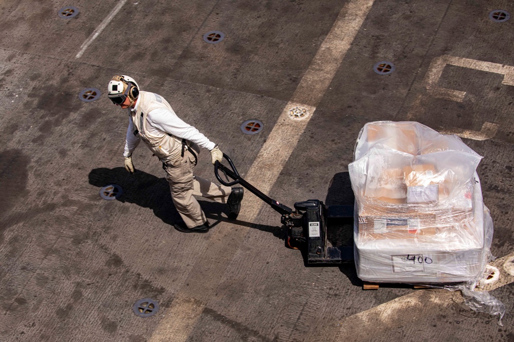 Sailors take part in a replenishment-at-sea