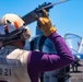 Sailors and Marines work on the flight deck aboard the New York