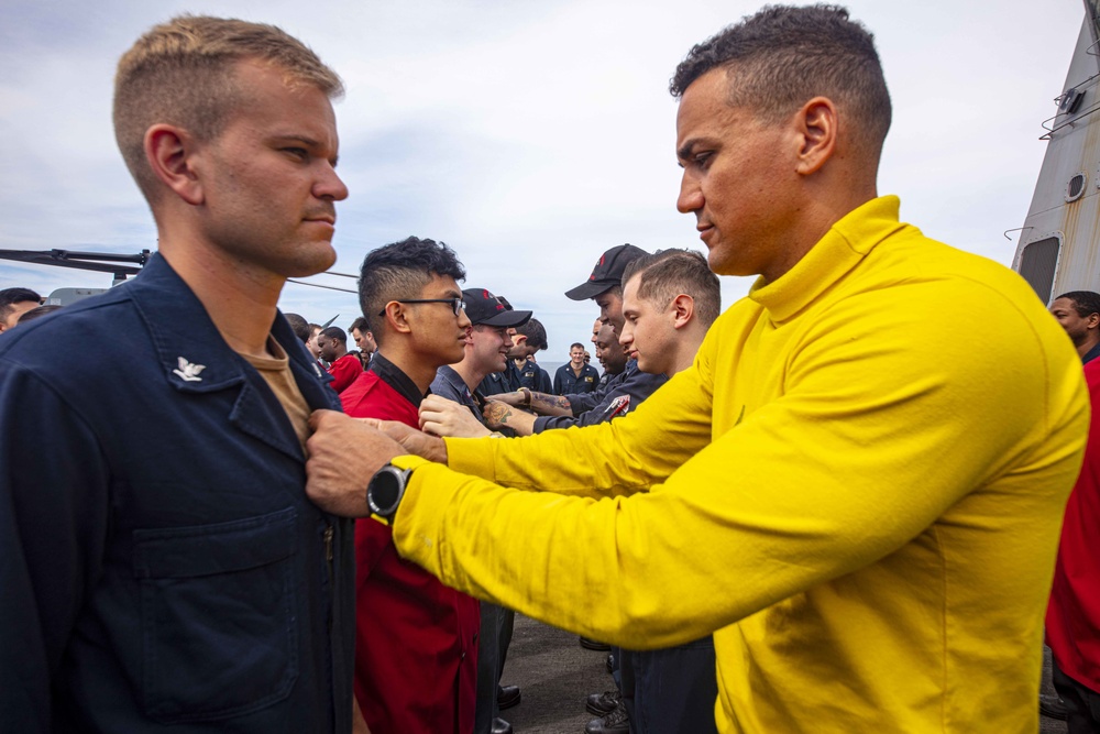 Sailors attend a All hands call aboard the USS New York