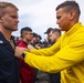 Sailors attend a All hands call aboard the USS New York