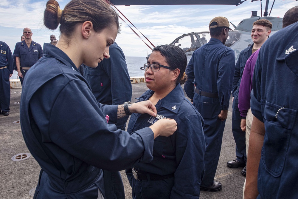 Sailors attend a All hands call aboard the USS New York