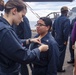 Sailors attend a All hands call aboard the USS New York