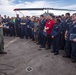 Sailors attend a All hands call aboard the USS New York