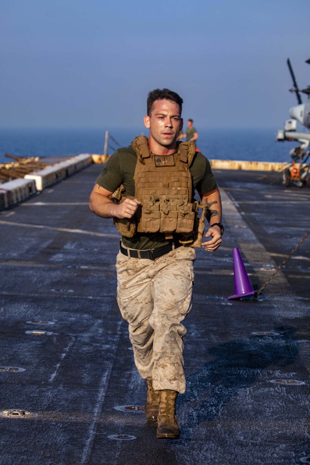 Sailors and Marines take part in the MURPH exercise