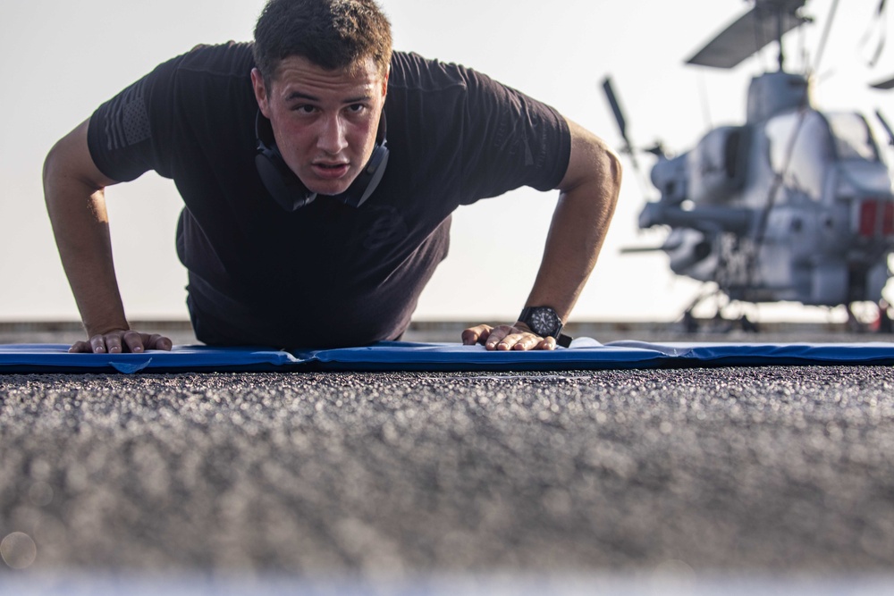 Sailors and Marines take part in the MURPH exercise