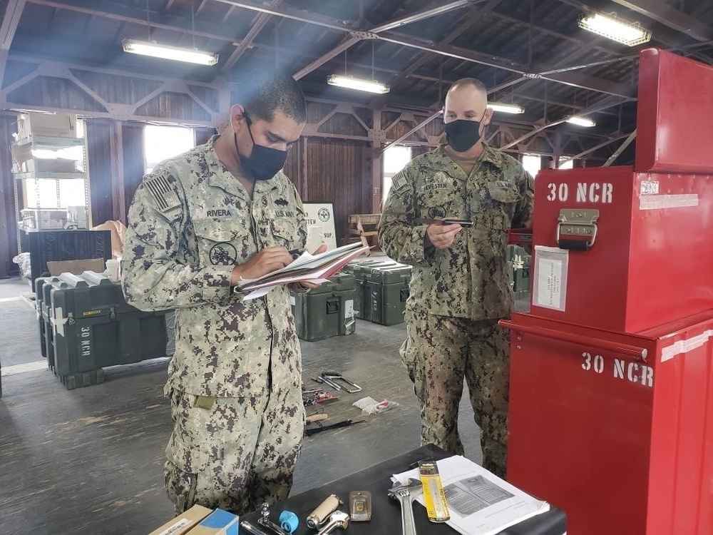 U.S. Navy Seabees with NMCB-5, Detail Sasebo, prepare for turnover