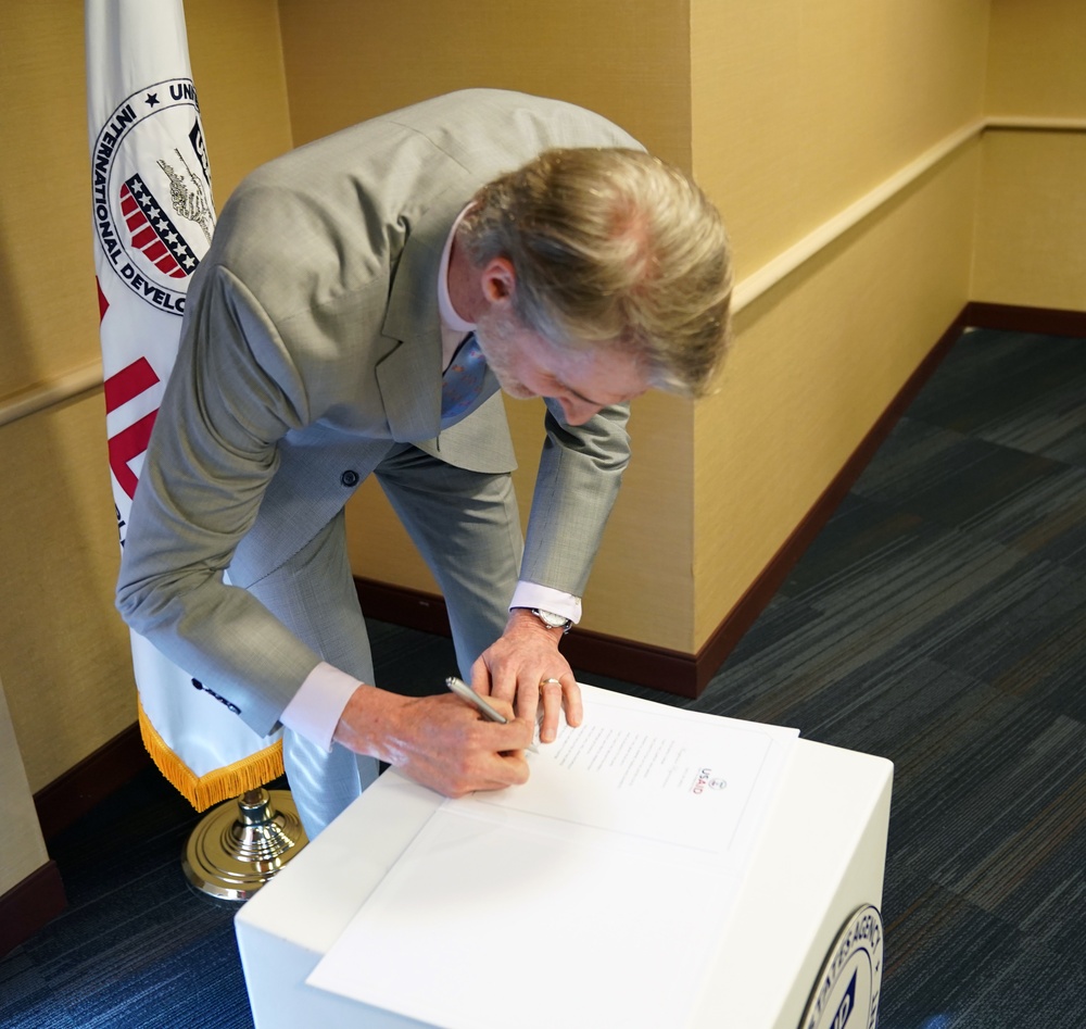 Signing in ceremony for Anu Rajaraman as Mission Director of Guatemala