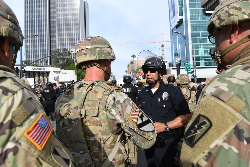 Commander of the 1-18th CAV speaks with LAPD during civil unrest mission in Los Angeles