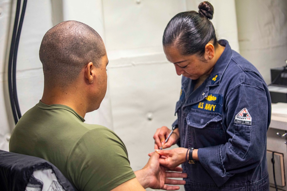 Sailors receive spa treatment for fathers day aboard the USS New York