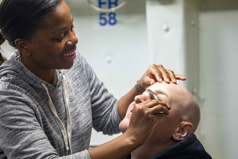 Sailors recieve spa treament for fathers day aboard the USS New York