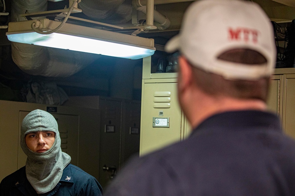 Sailors take part in a general quarters drill