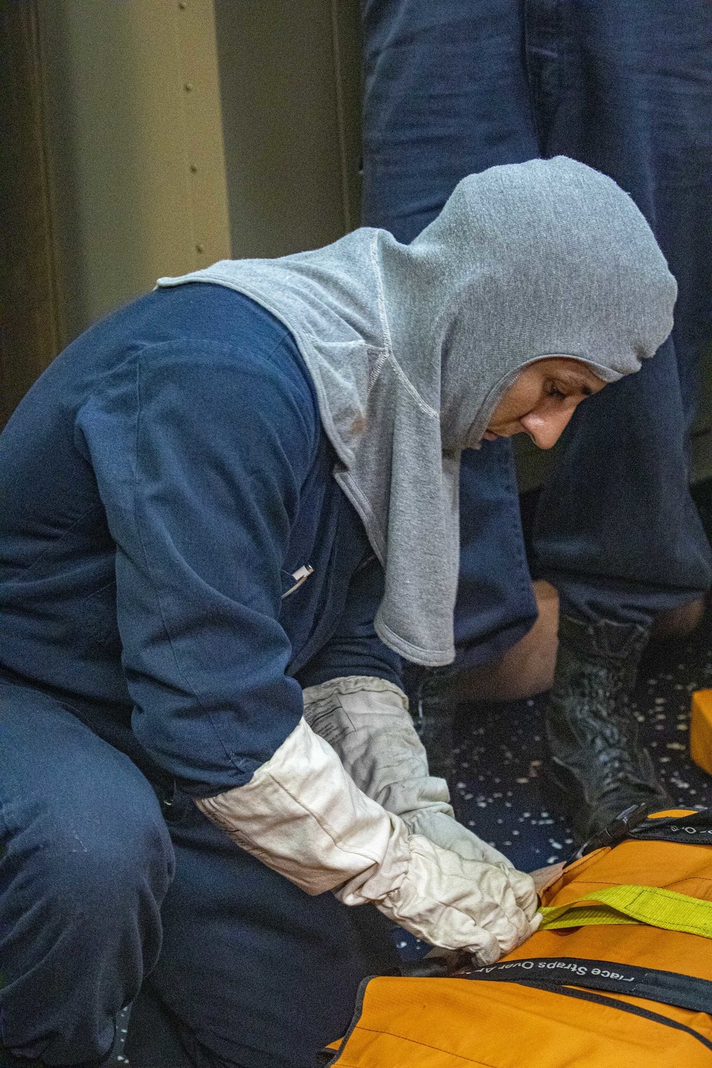 Sailors take part in a general quarters drill