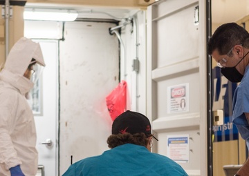 Battelle Employee Observes Decontamination Process