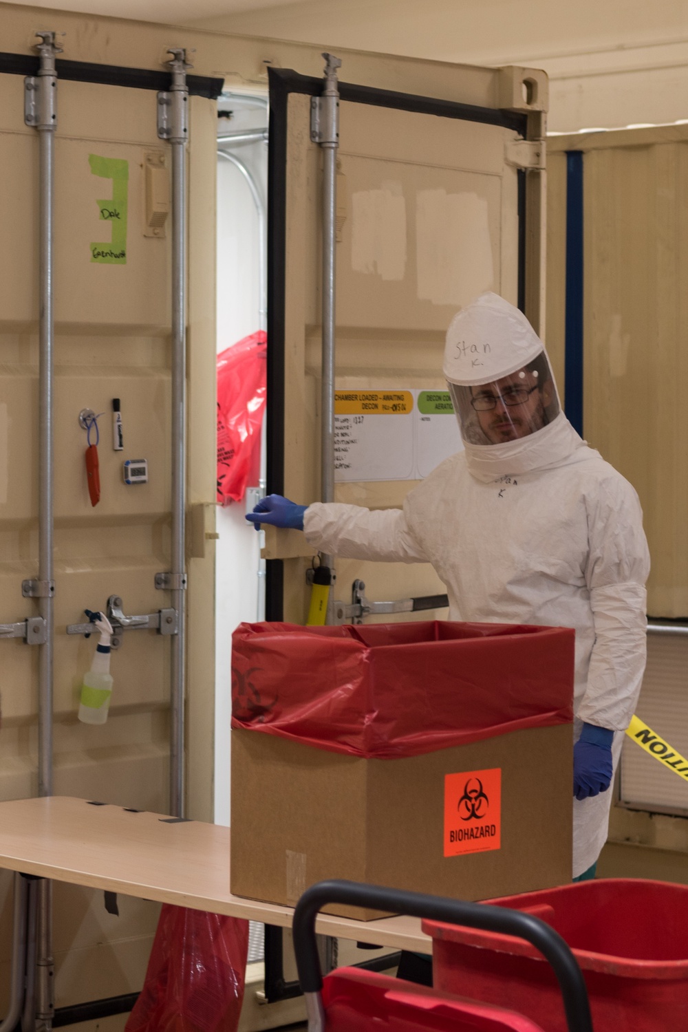 Battelle employee decontaminating N95 masks