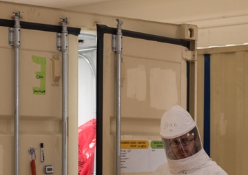 Battelle employee decontaminating N95 masks