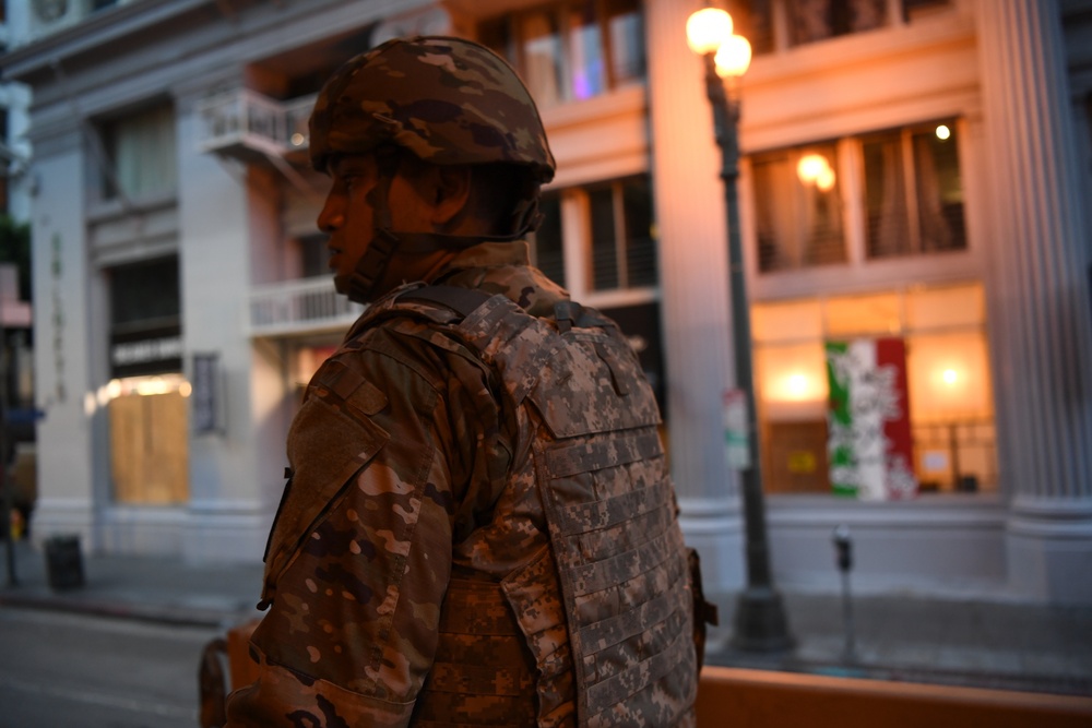 Cal Guard Soldiers stand watch in downtown Los Angeles during civil unrest response